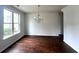 Spacious dining room featuring hardwood floors and a chandelier at 2469 Osceola Rd, Lithonia, GA 30058
