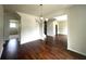 Spacious dining room featuring hardwood floors and a chandelier at 2469 Osceola Rd, Lithonia, GA 30058