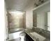 Clean bathroom with granite countertop, bathtub and shower at 2469 Osceola Rd, Lithonia, GA 30058