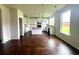Modern kitchen with white cabinets, island, and hardwood floors at 2469 Osceola Rd, Lithonia, GA 30058