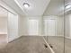 Finished basement area with mirrored wall and carpet at 6644 N Seminole Dr, Douglasville, GA 30135