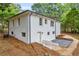 Rear view of the house showing a newly constructed deck and fresh paint at 5506 Alder Dr, Forest Park, GA 30297