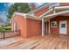 Back deck of home with brick exterior and access to backyard at 2505 Westchester Way, Conyers, GA 30013