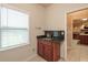Laundry room with granite countertop, custom cabinetry, and a sink at 2505 Westchester Way, Conyers, GA 30013