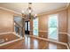 Bright dining room featuring hardwood floors and large windows at 2505 Westchester Way, Conyers, GA 30013