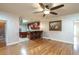 Open living room with hardwood floors and kitchen views at 2505 Westchester Way, Conyers, GA 30013