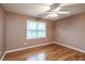 Comfortable bedroom with hardwood floors and a large window at 2505 Westchester Way, Conyers, GA 30013