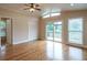 Large bedroom with hardwood floors and sliding glass doors to deck at 2505 Westchester Way, Conyers, GA 30013