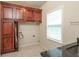 Laundry room with custom cabinetry, built-in ironing board, and granite countertop at 2505 Westchester Way, Conyers, GA 30013