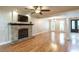 Spacious living room with hardwood floors and stone fireplace at 2505 Westchester Way, Conyers, GA 30013