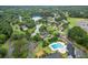 Community overview featuring a pool, tennis court, and pond at 2505 Westchester Way, Conyers, GA 30013