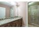 Bathroom with granite vanity, dark wood cabinets, and a large shower at 2505 Westchester Way, Conyers, GA 30013