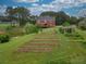 Elevated view of garden next to a pond at 2505 Westchester Way, Conyers, GA 30013