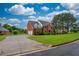 Brick house with a two-car garage and a well-manicured lawn at 2505 Westchester Way, Conyers, GA 30013