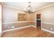 Formal dining room with hardwood floors and a chandelier at 2505 Westchester Way, Conyers, GA 30013