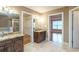 Elegant bathroom with double sinks, soaking tub, and separate shower at 2505 Westchester Way, Conyers, GA 30013