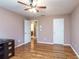 Well-lit bedroom with hardwood floors and access to a bathroom at 2505 Westchester Way, Conyers, GA 30013