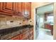 Butlers pantry with granite countertops and custom cabinetry at 2505 Westchester Way, Conyers, GA 30013