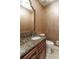 Powder room with granite countertop and decorative mirror at 2505 Westchester Way, Conyers, GA 30013