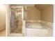 Bathroom with a large walk-in shower and soaking tub at 2505 Westchester Way, Conyers, GA 30013