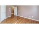 Spacious bedroom featuring hardwood floors and neutral wall colors at 2505 Westchester Way, Conyers, GA 30013