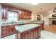 Large kitchen with granite countertops and custom cabinetry at 2505 Westchester Way, Conyers, GA 30013