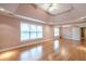 Large bedroom with hardwood floors and tray ceiling at 2505 Westchester Way, Conyers, GA 30013