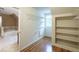 Large walk-in closet with built-in shelving and additional storage at 2505 Westchester Way, Conyers, GA 30013