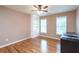 Charming bedroom with hardwood floors, built-in shelving, and ceiling fan at 2505 Westchester Way, Conyers, GA 30013