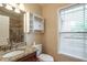 Bathroom with granite vanity, tiled shower, and built-in shelving at 2505 Westchester Way, Conyers, GA 30013