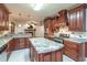 Spacious kitchen with granite island and stainless steel appliances at 2505 Westchester Way, Conyers, GA 30013