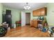 Small basement kitchen with wood cabinets and hardwood floors at 1812 Beckley Nw Pl, Kennesaw, GA 30152