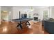 Game room with hardwood floors, pool table, and fireplace at 1812 Beckley Nw Pl, Kennesaw, GA 30152