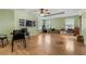 Large basement room with hardwood floors and built-in shelving at 1812 Beckley Nw Pl, Kennesaw, GA 30152