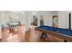 Open living area with hardwood floors, pool table, and dining area at 1812 Beckley Nw Pl, Kennesaw, GA 30152