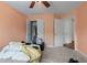 Bedroom with ceiling fan and double door closet at 1812 Beckley Nw Pl, Kennesaw, GA 30152