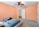 Spacious bedroom with ceiling fan and neutral walls at 1812 Beckley Nw Pl, Kennesaw, GA 30152