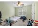 Bedroom with large window and ceiling fan at 1812 Beckley Nw Pl, Kennesaw, GA 30152