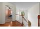 Upper hallway with hardwood floors and arch window at 1812 Beckley Nw Pl, Kennesaw, GA 30152