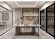 Modern home office with built-in shelving and large desk at 612 Saint Christopher Ln, Ellenwood, GA 30294