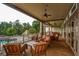 Relaxing covered porch overlooking the pool and wooded area at 418 Laurel Spring Ct, Canton, GA 30114