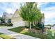 House exterior showcasing a two-car garage and well-maintained landscaping at 418 Laurel Spring Ct, Canton, GA 30114