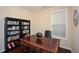 Home office features built-in bookcases and a large desk at 418 Laurel Spring Ct, Canton, GA 30114