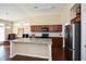 Spacious kitchen boasts granite island and hardwood floors at 418 Laurel Spring Ct, Canton, GA 30114