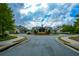 Community center exterior with landscaping and a circular drive at 418 Laurel Spring Ct, Canton, GA 30114