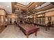 Game room with pool tables, fireplace, and bar area at 418 Laurel Spring Ct, Canton, GA 30114