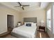 Main bedroom with ceiling fan and ensuite bathroom access at 418 Laurel Spring Ct, Canton, GA 30114