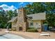 Community pool house with fireplace and cornhole at 418 Laurel Spring Ct, Canton, GA 30114