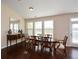 Formal dining room with hardwood floors and large windows at 418 Laurel Spring Ct, Canton, GA 30114