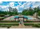 Community pool area with a view of the lake at 418 Laurel Spring Ct, Canton, GA 30114